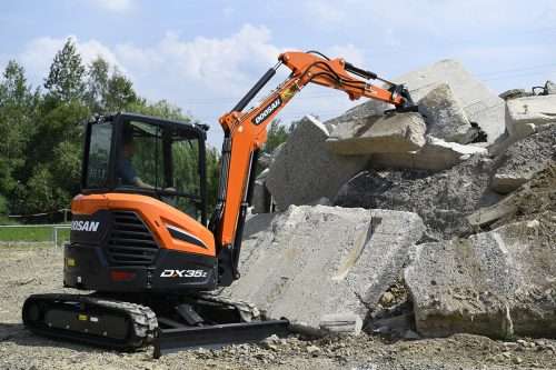 The new style Develon DX35x excavator moving concrete
